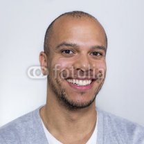 Portrait-of-a-man-in-a-tee-shirt-smiling-to-camera.jpg
