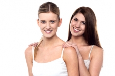 Two_attractive_girls_posing_in_sleeveless_spaghetti.jpg