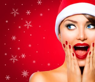 Christmas_Woman._Beauty_Model_Girl_in_Santa_Hat_over_Red_xs.jpg