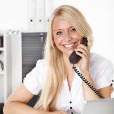 Female_office_assistant_has_a_call_at_the_office_2_s.jpg
