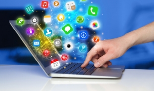 Hand_pressing_modern_laptop_with_mobile_app_icons_and_symbols.jpg